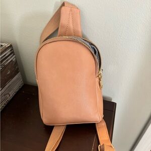 Peach colored crossbody bag